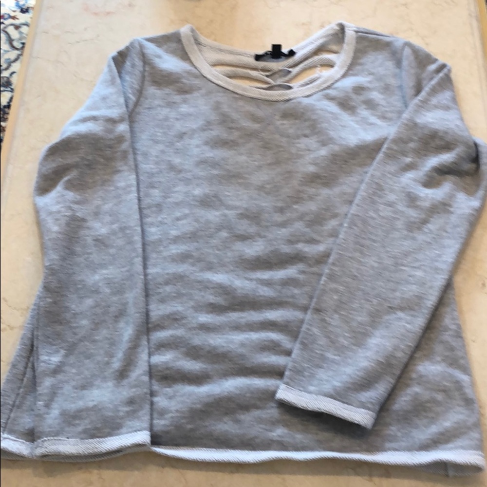 Itro sweatshirt shredded details on back.
